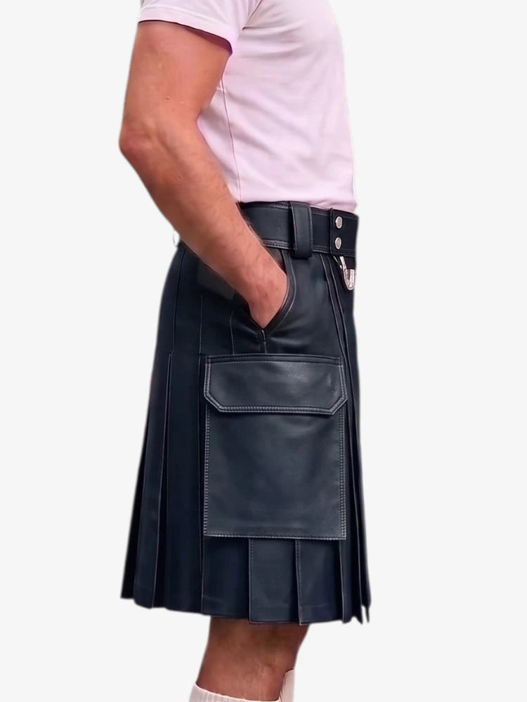 A person wearing a black pleated faux-leather kilt with a front flap pocket, shown from the waist down against a plain light background.