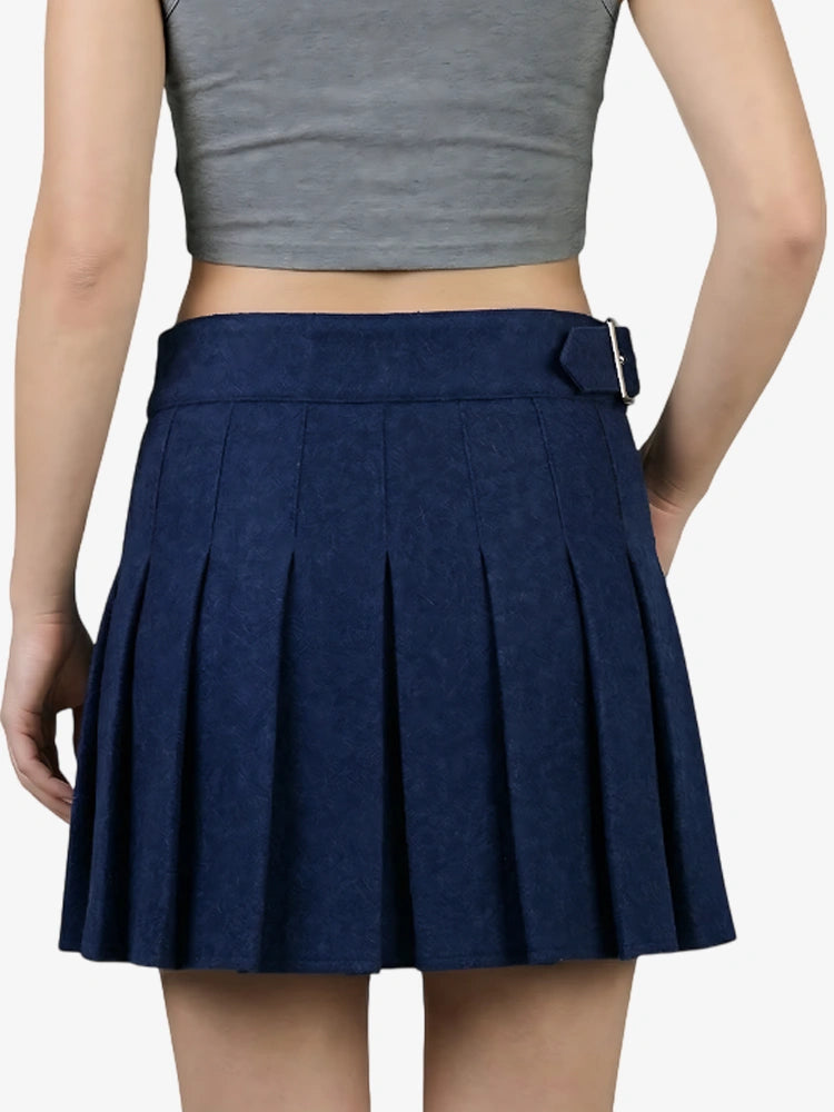 Navy pleated skirt worn by a person on a white background