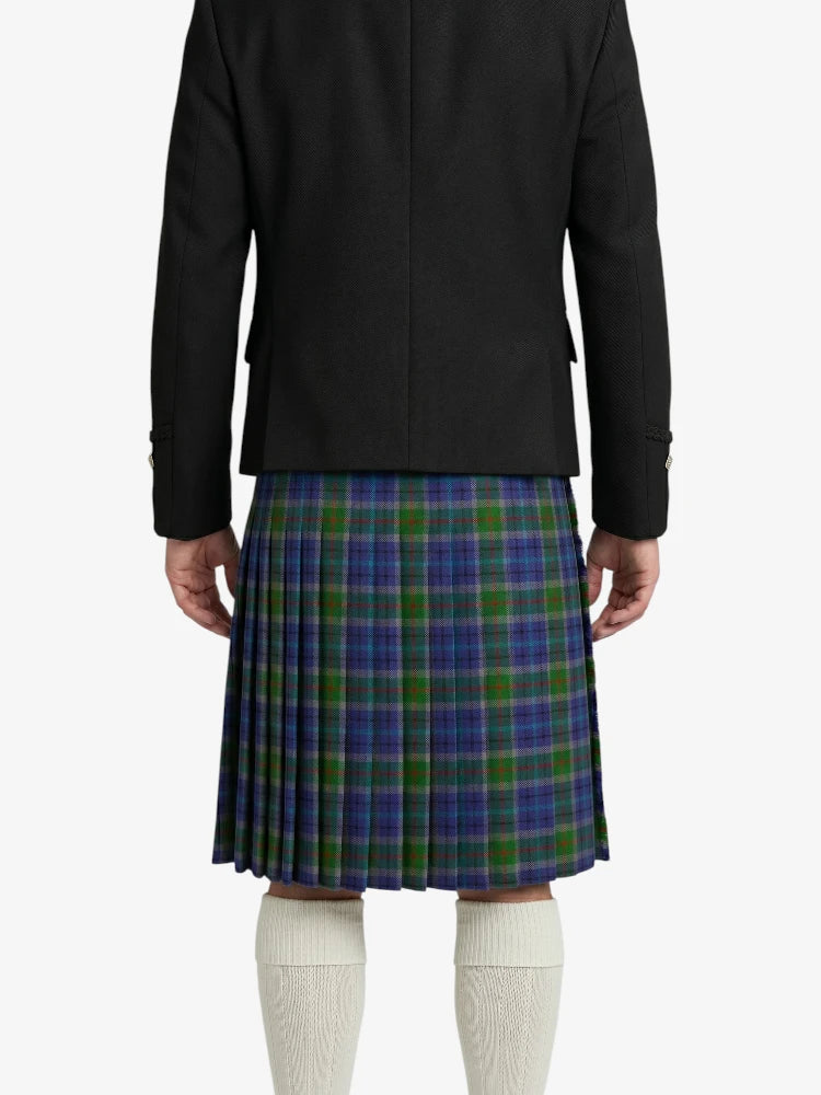 Person wearing a black jacket and a green plaid kilt on a white background