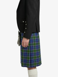 Person wearing a black jacket and a blue plaid kilt on a white background