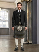 Man wearing a traditional Scottish kilt in an elegant interior setting