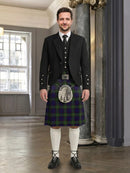 Man wearing a traditional Scottish kilt in an elegant interior setting