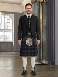 Man wearing a traditional Scottish kilt in an elegant interior setting