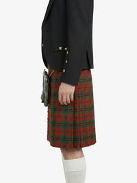 Person wearing a black blazer and red plaid kilt on a white background