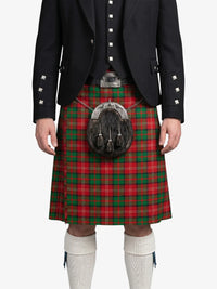 Person wearing a traditional Scottish kilt with a tartan pattern on a white background