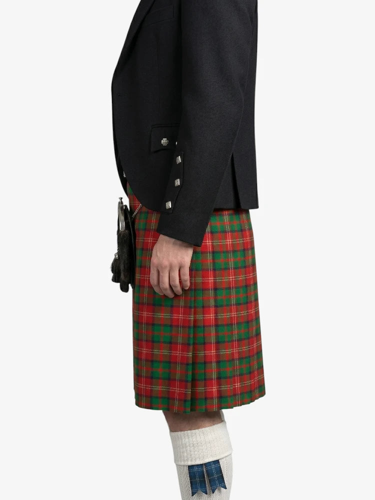 Person wearing a black jacket and red plaid kilt on a white background