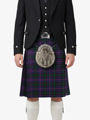 Person wearing a Scottish kilt with a jacket on a white background