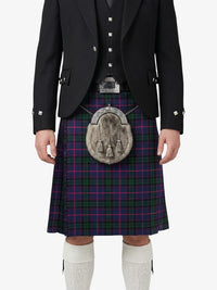 Person wearing a Scottish kilt with a jacket on a white background