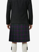 Person wearing a black coat and plaid kilt on a white background
