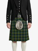 Person wearing a green plaid kilt with a black jacket on a white background