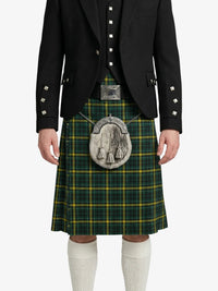 Person wearing a green plaid kilt with a black jacket on a white background