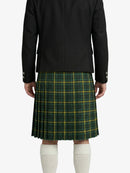 Person wearing a black jacket and green plaid kilt on a white background