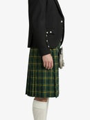 Person wearing a black blazer and green plaid kilt on a white background
