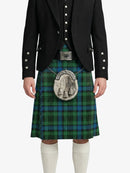 Person wearing a green plaid kilt with a black jacket on a white background