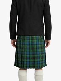 Person wearing a black jacket and green plaid kilt on a white background