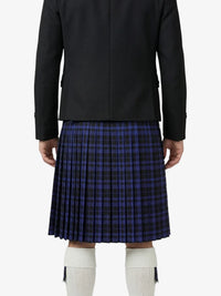 Person wearing a black jacket and blue plaid kilt on a white background