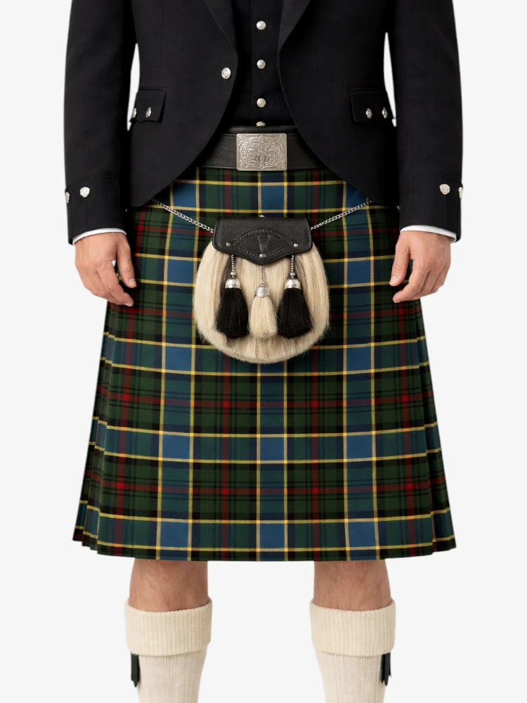 Person wearing a traditional Scottish kilt with a tartan pattern on a white background