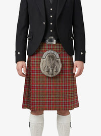 Person wearing a traditional Scottish kilt with a jacket on a white background