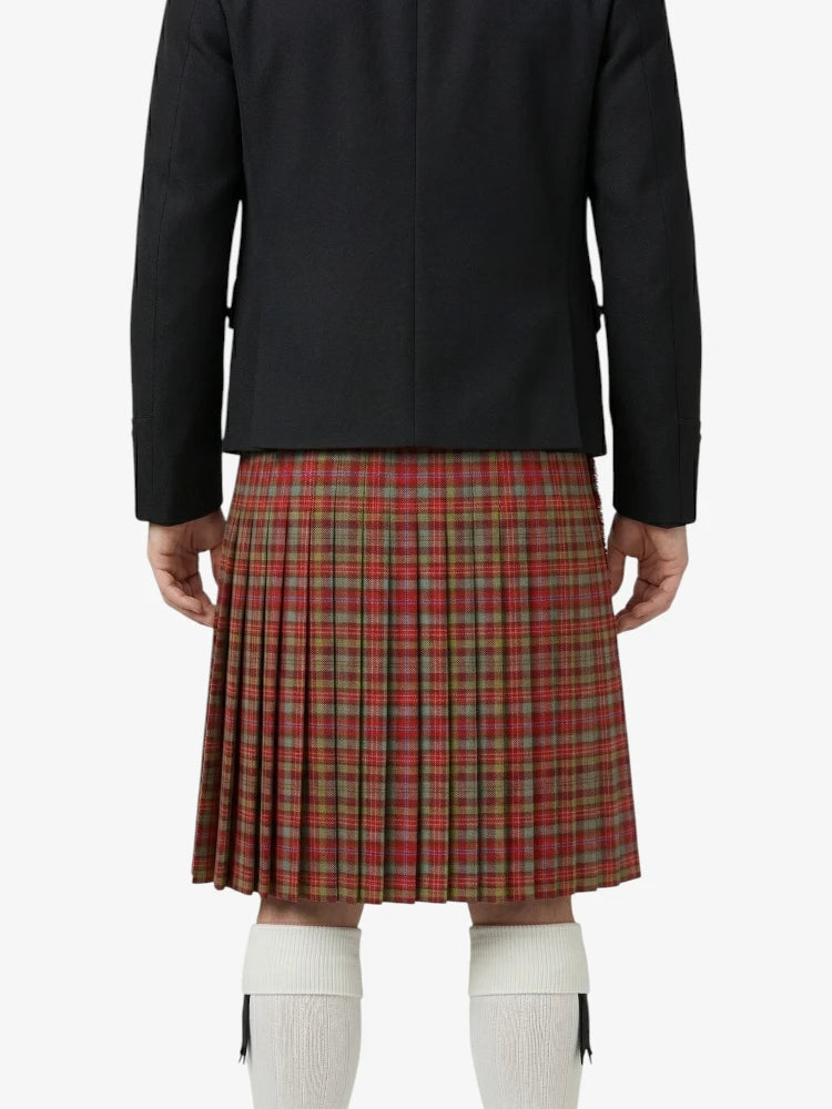 Person wearing a black jacket and red plaid kilt on a white background