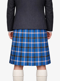 Person wearing a black jacket and blue plaid Kilt on a white background