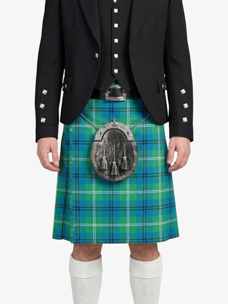 Person wearing a black jacket and green plaid kilt on a white background