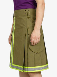 Green kilt with reflective trim worn by a person on a white background