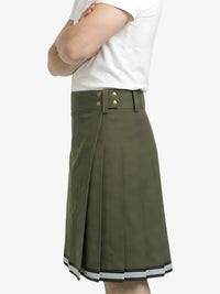 Green skirt with white trim worn by a person on a white background