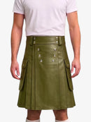 An olive green faux leather kilt with silver-tone metal studs and flap pockets, worn by a model in a white t-shirt against a light gray background.