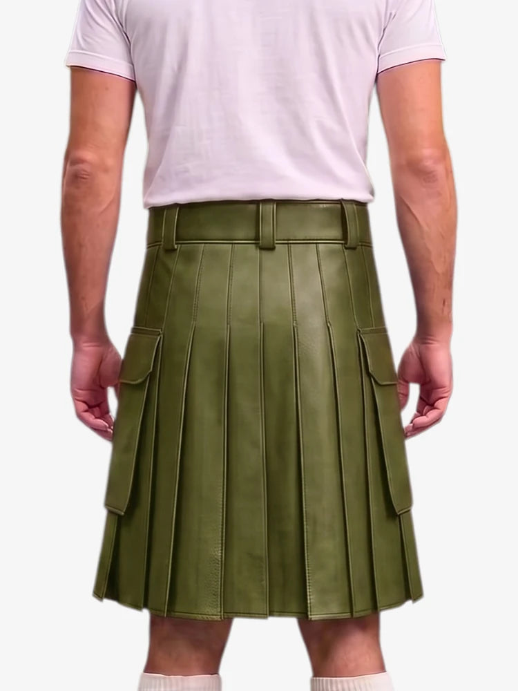 An olive green faux leather pleated kilt with side cargo pockets, shown on a model from the back wearing a light pink t-shirt against a white background.