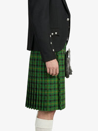 Person wearing a black jacket and green plaid kilt on a white background