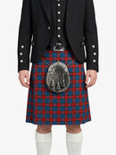 Person wearing a traditional Scottish kilt with a sporran on a white background