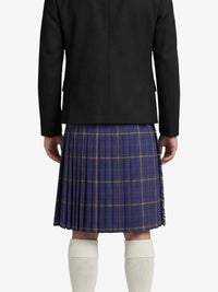 Person wearing a black coat and blue plaid skirt on a white background