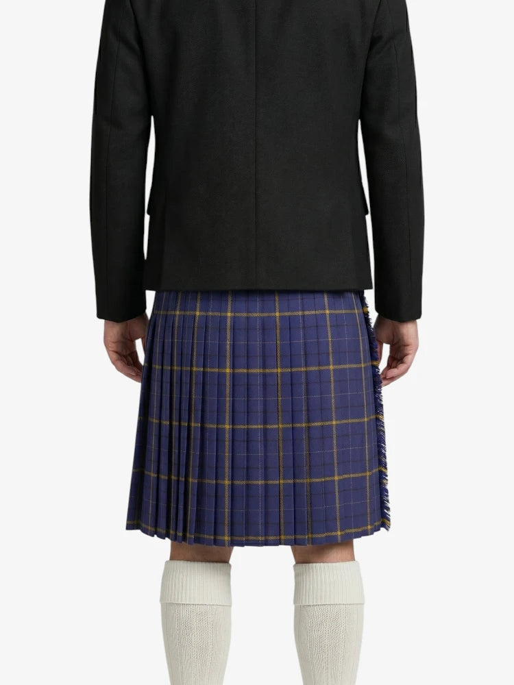Person wearing a black coat and blue plaid skirt on a white background