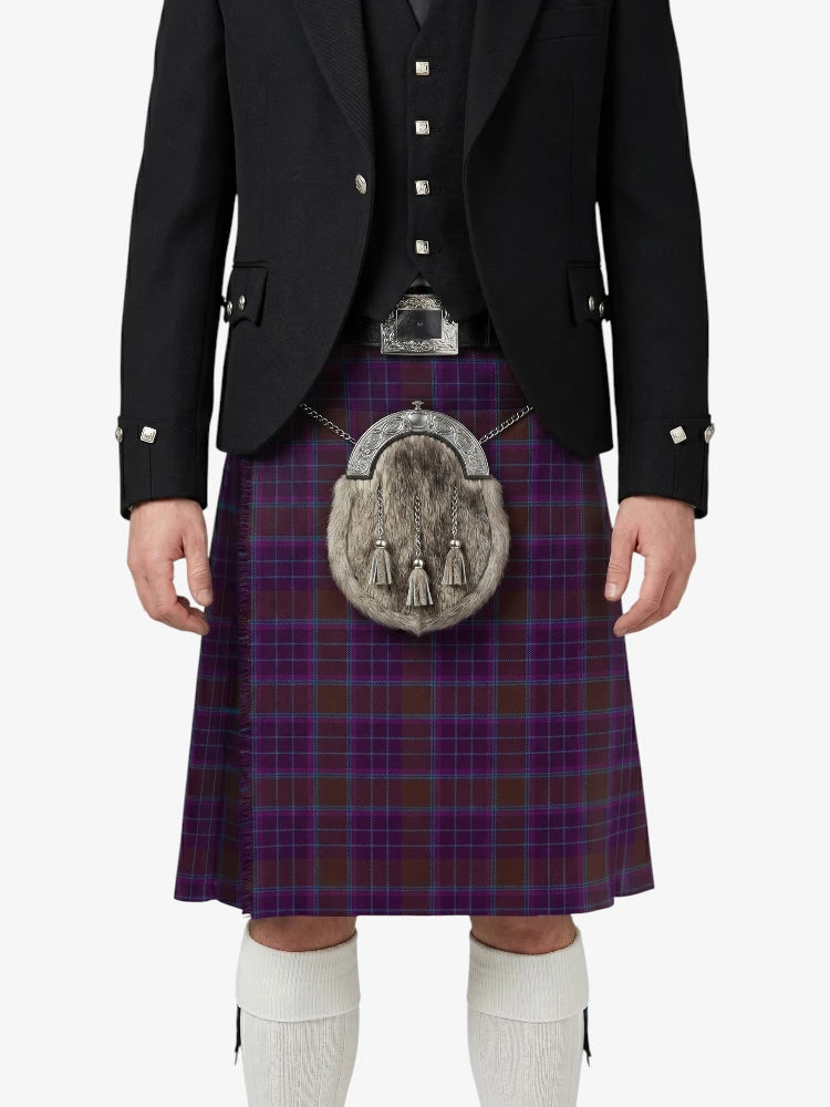Person wearing a traditional Scottish kilt with a tartan pattern on a white background