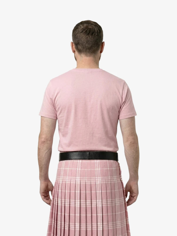 Person wearing a pink t-shirt and pink plaid kilt from the back on a white background