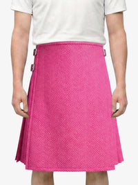 Person wearing a pink skirt with a white background