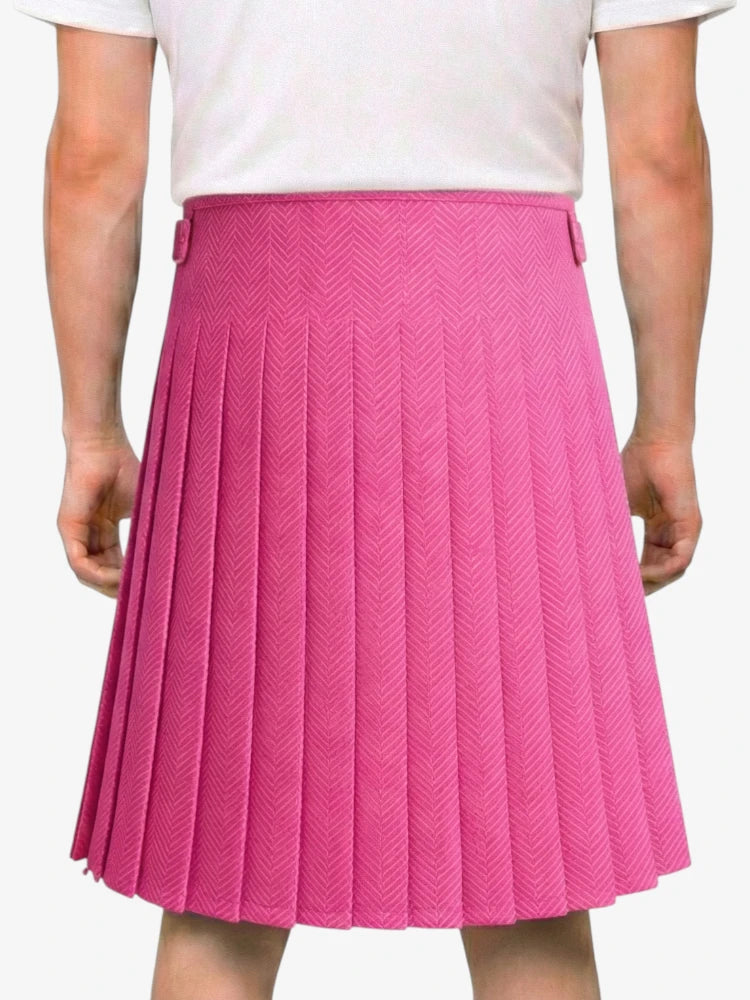 Person wearing a pink pleated skirt on a white background