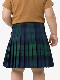 Child wearing a green plaid skirt on a white background
