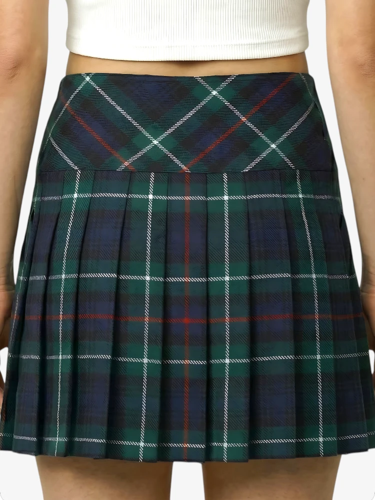 Green plaid skirt worn by a person on a white background