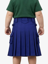 Child wearing a green shirt and blue pleated skirt on a white background