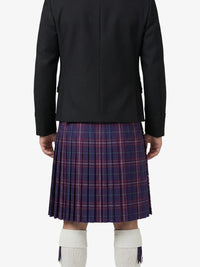 Person wearing a black jacket and plaid kilt on a white background
