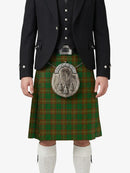Traditional Scottish kilt with a dark jacket and white socks on a white background