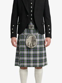 Person wearing a traditional Scottish kilt with a jacket on a white background