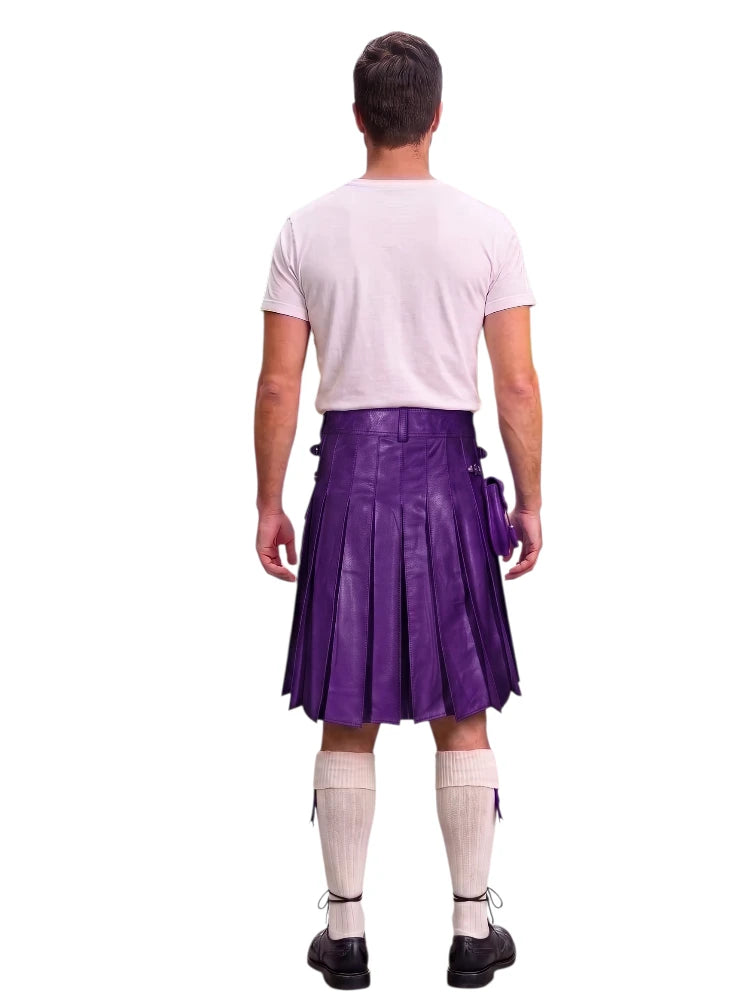 A man shown from the back wearing a purple pleated kilt, a light pink t-shirt, white knee-high socks, and black shoes, isolated on a white background.