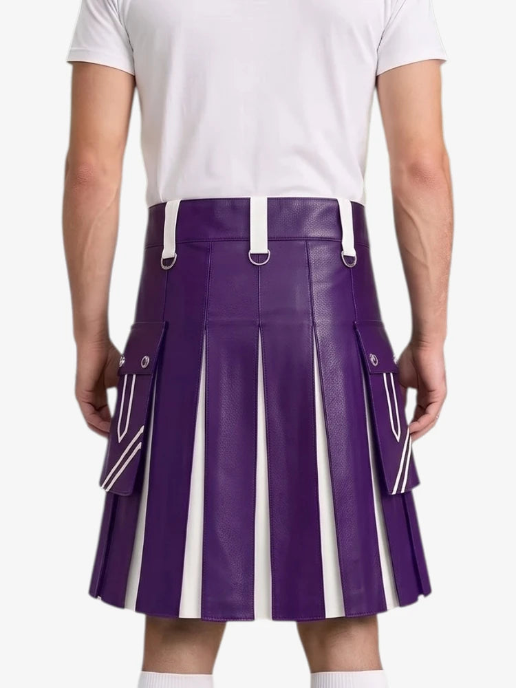 A person shown from the back wearing a purple pleated faux-leather kilt with white suspenders and side cargo pockets, paired with a white t-shirt and white socks, against a light gray studio background.
