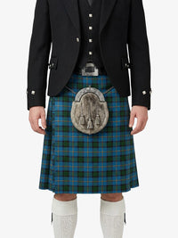 Person wearing a traditional Scottish kilt with a tartan pattern on a white background