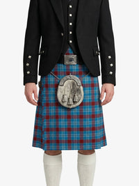 Person wearing a black jacket and blue plaid kilt with a silver sporran on a white background