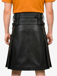 Person wearing a black leather skirt with orange top on a white background