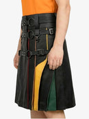 Black leather skirt with colorful accents worn by a person on a white background