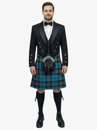 Man wearing a traditional Scottish ramsay blue tartan kilt with a black prince charlie jacket and bow tie on a white background